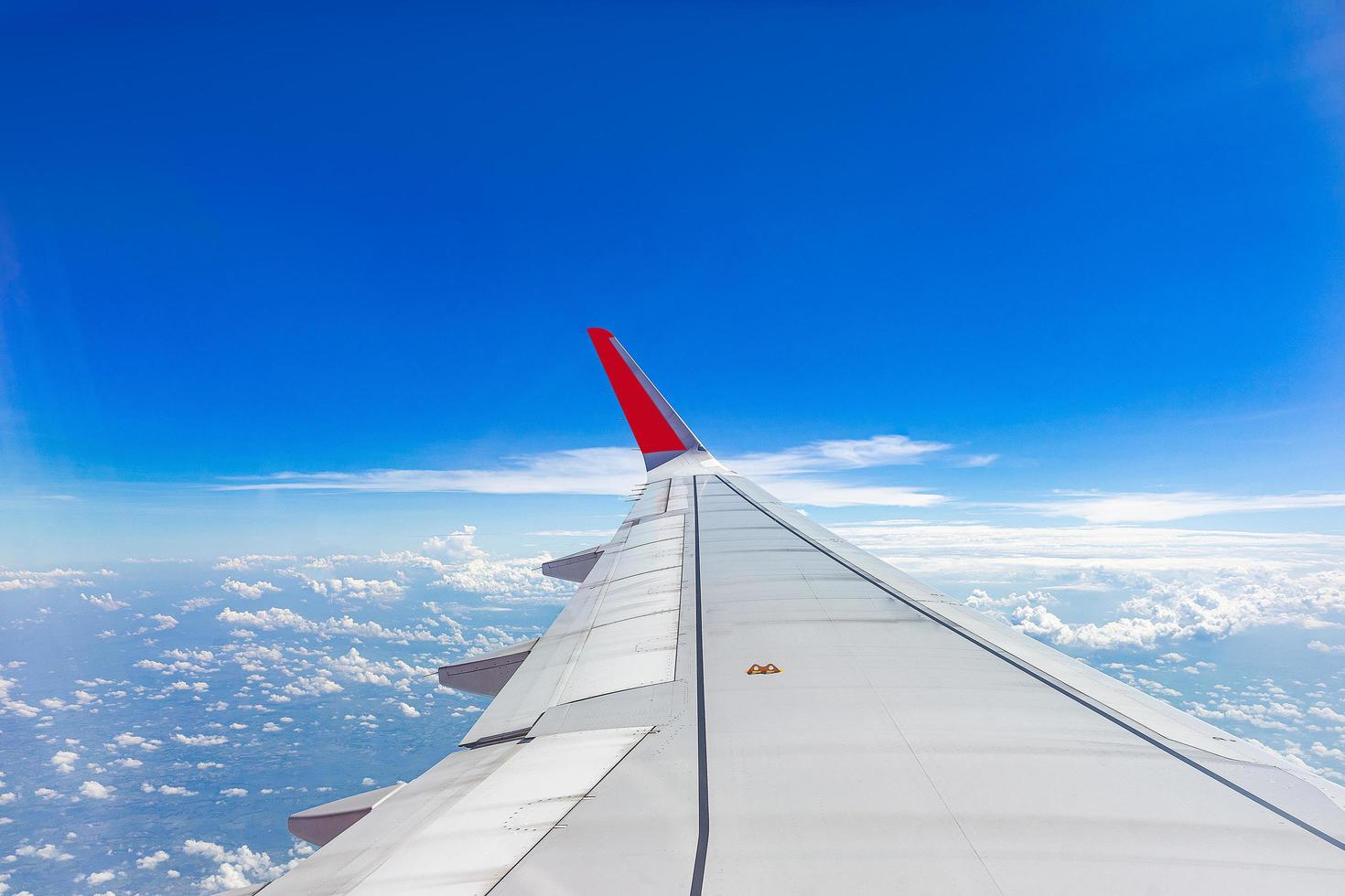 View from an aircraft wing above the clouds